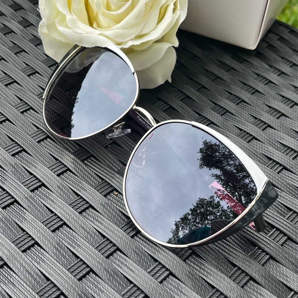 Black and white frame with smokey black lens